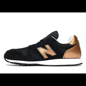 Black and rose gold New Balance 520 sneakers